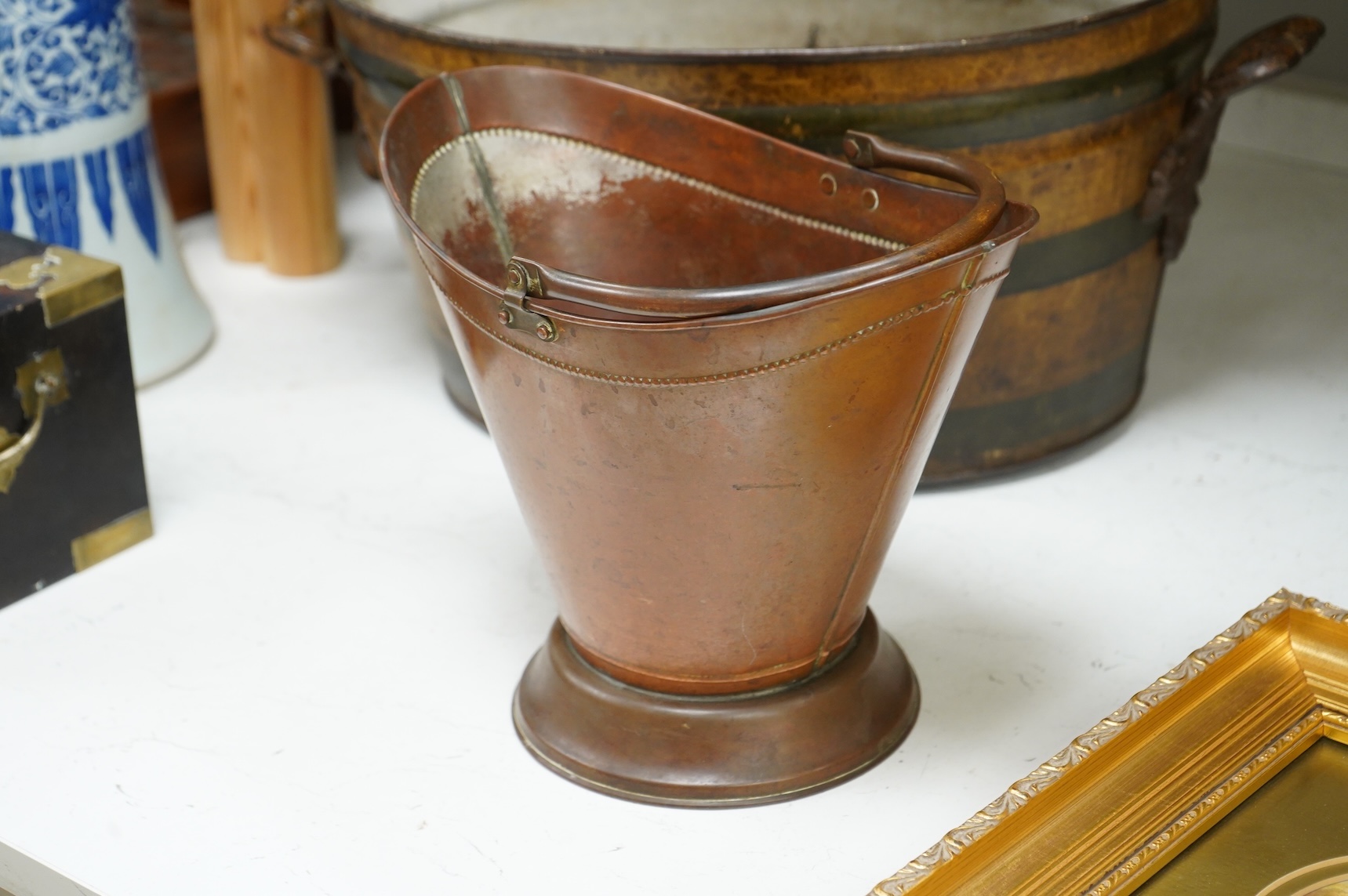 An oval toleware bin and another similar smaller bucket with swing handle, 48cm wide